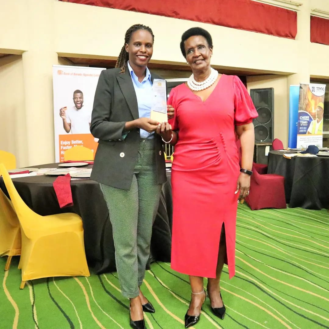 Ms. Sharon from Biyinzika Poutry Bleeders Limited together with Hon. Amelia Kyambadde celebrating after receiving an award at the East Africa Brand Quality Awards 2022 Ms. Sharon from Biyinzika Poutry Bleeders Limited together with Hon. Amelia Kyambadde celebrating after receiving an award at the East Africa Brand Quality Awards 2022
