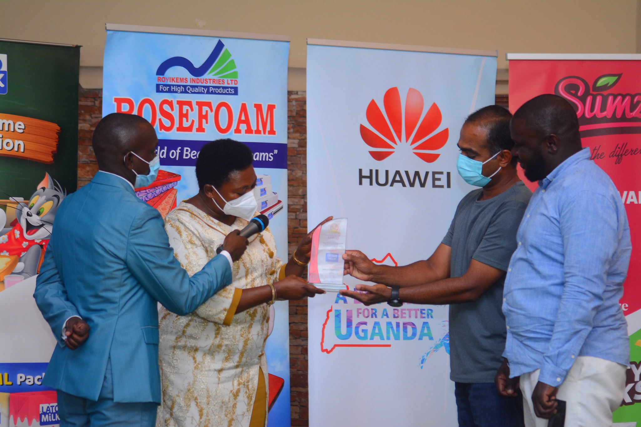 LATO Milk Pearl Dairy Farms Ltd represented by Mr. Bijoy recieving the East Africa Brand Quality Awards 2021