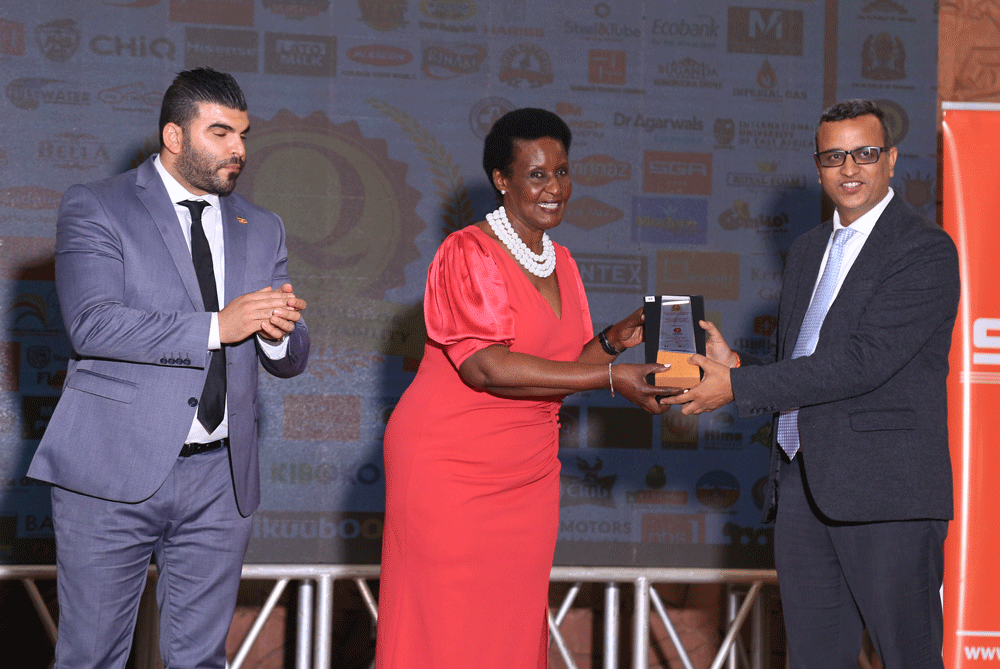 Mr.-Vijay-Country-Director,-Chandaria-Industries-recieving-an-award-for-East-frica-Brand-Quality-Awards