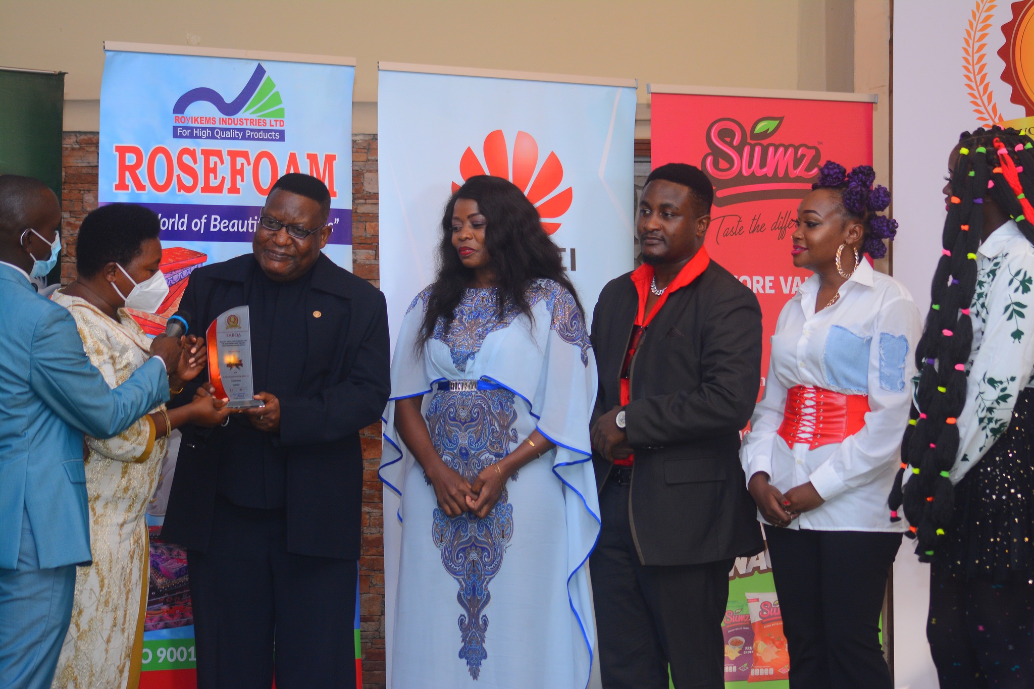 The Ebonies recieving the award the East Africa Brand Quality Awards 2021